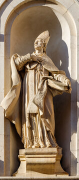 Lucca - The statue of St. Paolino on the facade of church Chiesa di San Paolino by Giovanni Lazzoni (cca. 1700)