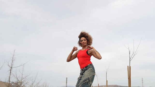 A Dynamic Woman Dancing Joyfully and Happily in Natures Beautiful Scenery and Landscape