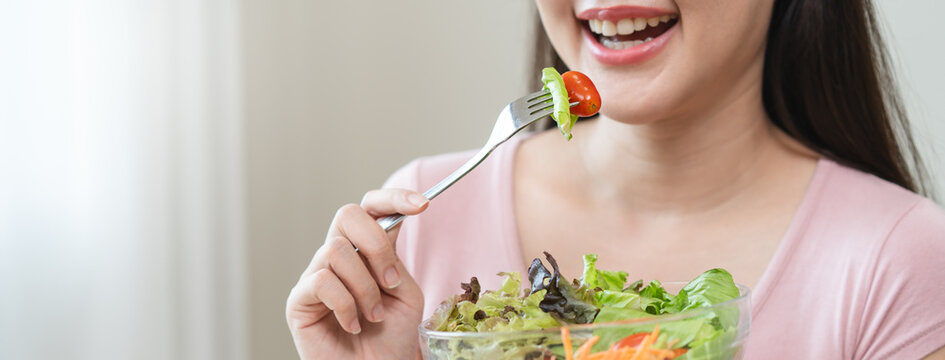 Happy wellness meal, Woman eats salad as lunch and controls calories for the meal for her body care