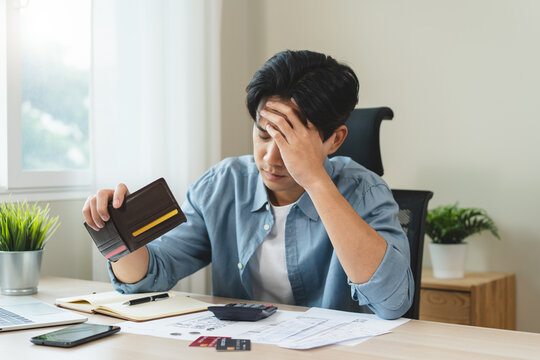 Stressed bankrupt financial crisis concept, Young adult in nervous after calculated loan expense and can not pay to bank.