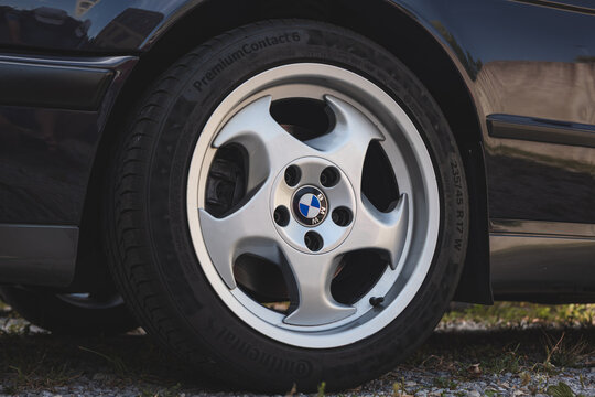 Lindau, Switzerland, August 9, 2026. Close up view of Style 18 alloy wheel mounted on classic BMW E34 M5 sports sedan.