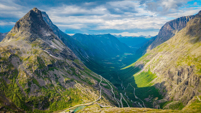 Aerial perspective of the steep valley and hairpin turns of the Trollstigen mountain pass road in Rauma, Norway