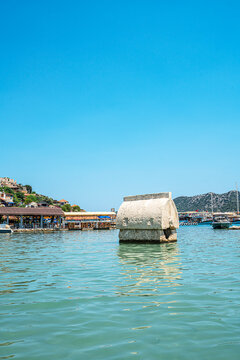 Turquoise waters and ancient Lycian coast of Kekova Island during a boat cruise in Antalya, Turkey.