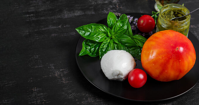 Rustic Italian Food Concept with Tomato, Basil and Mozzarella. Overhead