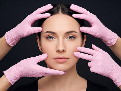 Generative AI, Close-up portrait of a woman with healthy skin receiving a facial beauty treatment from professionals wearing pink gloves, representing skincare, cosmetology, beauty care