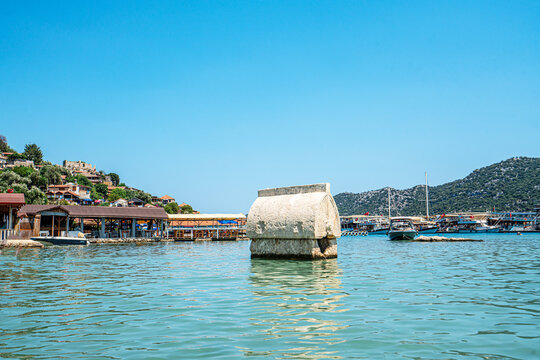 Turquoise waters and ancient Lycian coast of Kekova Island during a boat cruise in Antalya, Turkey.