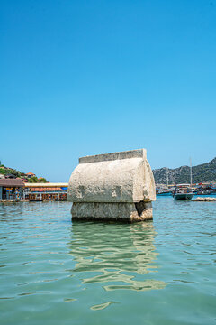 Turquoise waters and ancient Lycian coast of Kekova Island during a boat cruise in Antalya, Turkey.