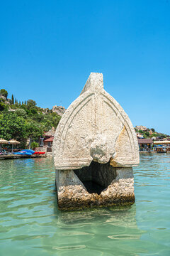 Turquoise waters and ancient Lycian coast of Kekova Island during a boat cruise in Antalya, Turkey.