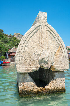 Turquoise waters and ancient Lycian coast of Kekova Island during a boat cruise in Antalya, Turkey.