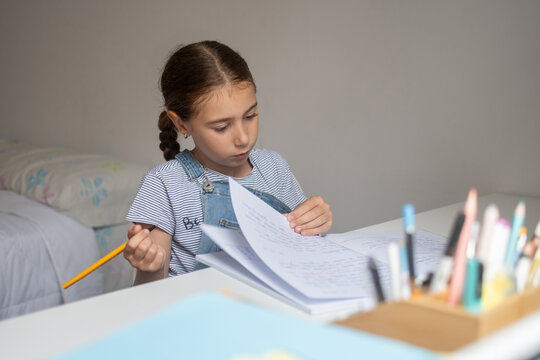 Girl Doing Homework at Her Desk