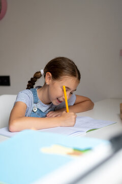 Girl Doing Homework at Her Desk
