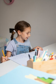 Girl Doing Homework at Her Desk
