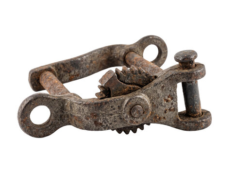 Vintage rusty metal gear mechanism for industrial machinery tool isolated on black background, showcasing aged iron ratchet clamp hardware, antique engineering, and corroded steel equipment part.