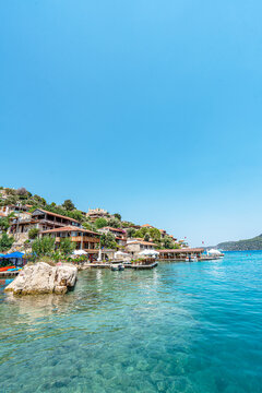 Turquoise waters and ancient Lycian coast of Kekova Island during a boat cruise in Antalya, Turkey.