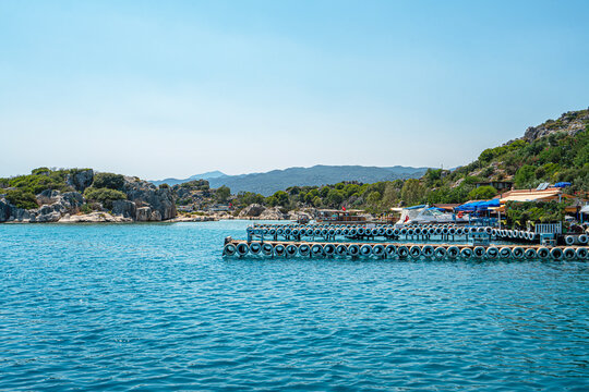 Turquoise waters and ancient Lycian coast of Kekova Island during a boat cruise in Antalya, Turkey.