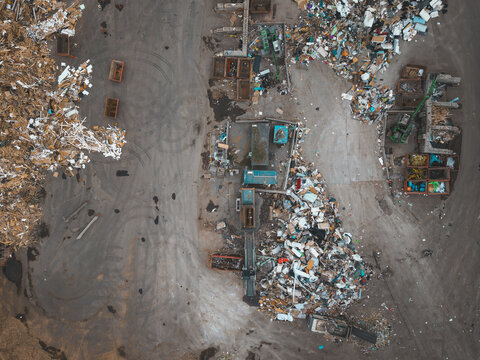 Aerial view of the Agnesberg waste management and recycling facility featuring large piles of sorted waste, industrial machinery, and containers in Gothenburg, Vastra Gotaland Count, Sweden.