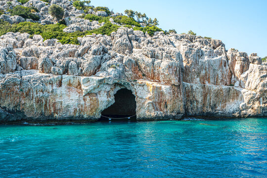 Turquoise waters and ancient Lycian coast of Kekova Island during a boat cruise in Antalya, Turkey.