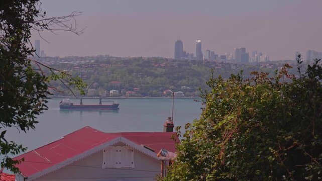 White Wooden Mansion on Istanbul Asian Shore with Bosphorus, Cargo Ship and European Skyline