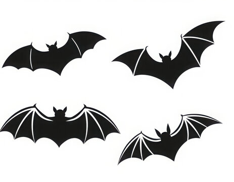Black bat silhouettes set flying isolated on white background