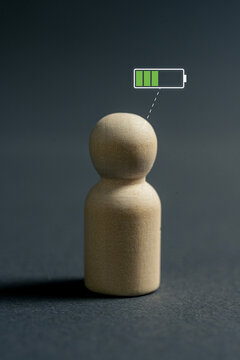 Person with balanced energy level and battery indicator representing motivation and sustainable productivity