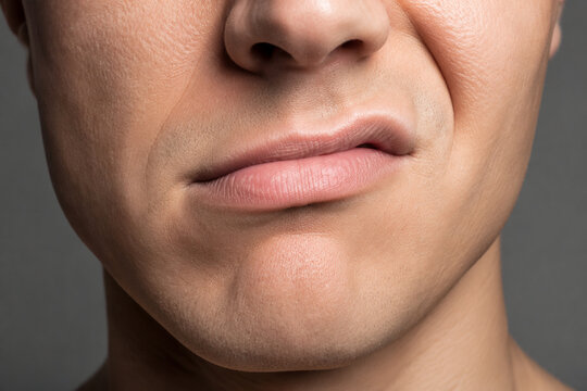 Sneering mouth close-up, emotion and attitude concept