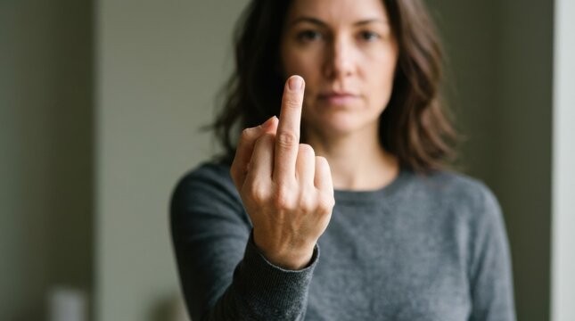 Woman Showing Middle Finger with Defiant Expression