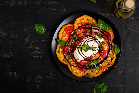 Fresh Italian Burrata Salad with Tomatoes and Balsamic Glaze. Top view