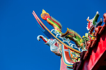 Taiwanese traditional temple roof cutting and carving and eaves decoration art © paul