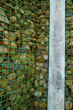 Stone Wall Reinforced With Green Wire Mesh