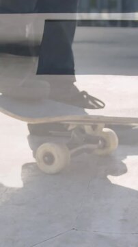 Animation of legs of man with skateboard over caucasian man skateboarding