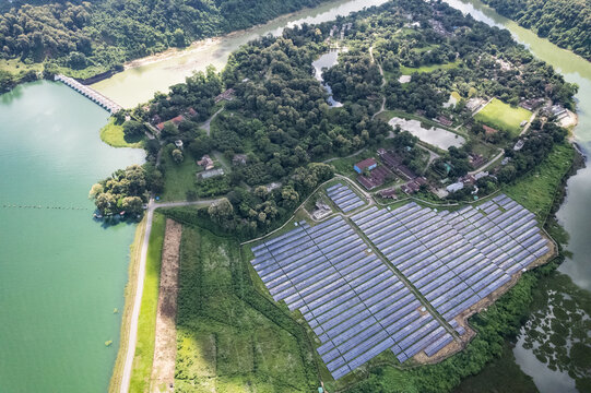 Aerial view of the Kaptai 7.4MW Solar Power Plant situated on a lush green peninsula beside the Kaptai Lake and dam in Kaptai, Chittagong Division, Bangladesh.