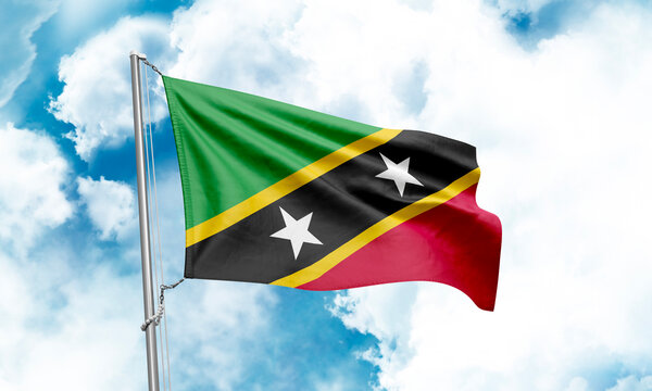 Saint Kitts and Nevis flag waving on sky background. 3D Rendering