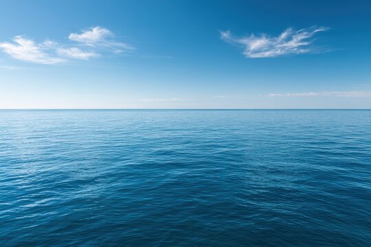 Minimalist seascape featuring clear blue sky and tranquil azure sea