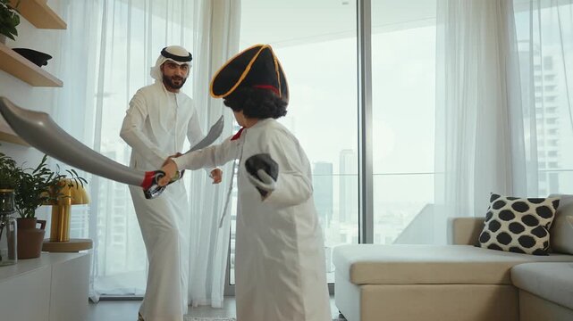 Emirati family playing with son wearing pirate costume