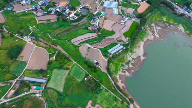 Top down 4K drone view of Yeosu Dolsan farmland fields and rural patterns in August