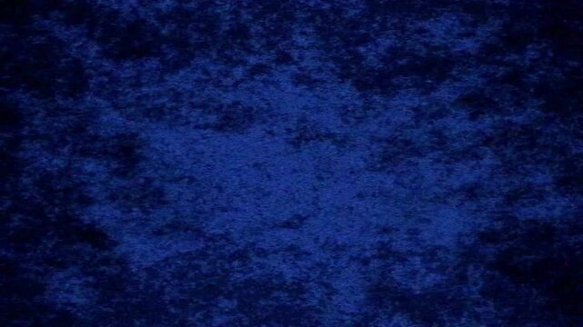 Abstract deep blue velvet fabric texture moving in slow motion cinematic 4k footage for luxury background and elegant textile surface design presentation