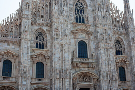 Duomo di Milano Cathedral View Framed by Archway Columns in Piazza del Duomo Milan Italy. Mariae Nascenti wall windows facade.
