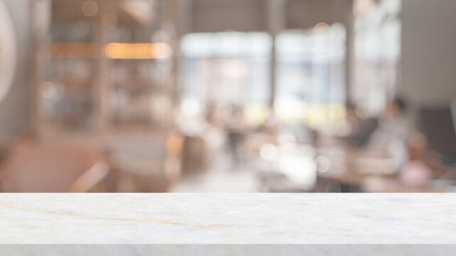 White marble table top with blurred cafe restaurant interior background for product display