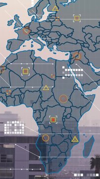 Animation of world map and data processing against aerial view of cityscape