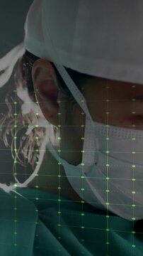 Surgeon preparing for surgery with green heartbeat animation over medical grid