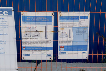 Fototapeta premium close-up of “Notice of Application — First Party Sign Variance” at SkyTower by Pinnacle International at 1 Yonge St, Toronto