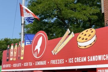Fototapeta premium big fun sign outside Red Rocket Coffee (Greektown) during Taste of the Danforth 2026 located outside 484 Danforth Av, Toronto