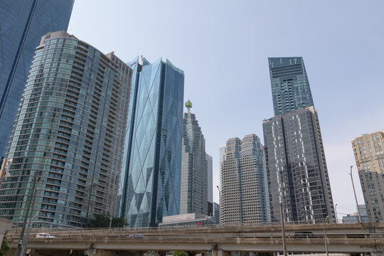 looking north from Lake Shore Blvd E to condos and business towers in downtown Toronto