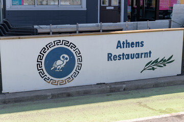 Fototapeta premium street sign outside Athens Restaurant, a Greek restaurant located at 707 Danforth Av, Toronto