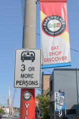 Fototapeta premium pole-mounted projecting banner at Pape Village, Toronto