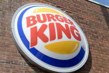 Fototapeta premium 3d round button sign on the exterior of Burger King, a fast food restaurant chain, located here at 1068 Pape Av, East York, Toronto