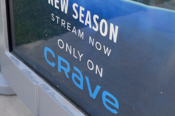Fototapeta premium close-up detail of an OOH bus shelter advertising poster for Crave online streaming service in Toronto