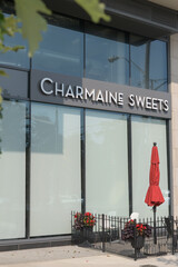Fototapeta premium patio seating outside Charmaine Sweets, a bakery, located at 939 Eglinton Av E, East York, Toronto