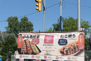 Fototapeta premium Ryus Noodle Bar banner at Taste of the Danforth, 2026, in Toronto