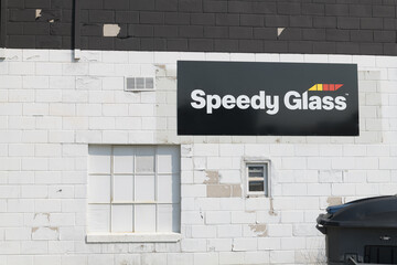 Fototapeta premium sign at Speedy Glass Leaside, an auto glass shop, located at 121 Laird Dr, East York, Toronto